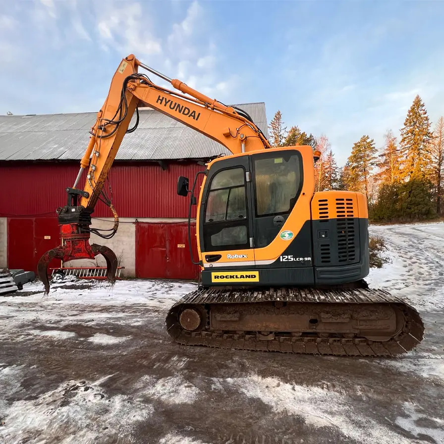 Grävmaskin Hyundai 125 med rivningsgrip